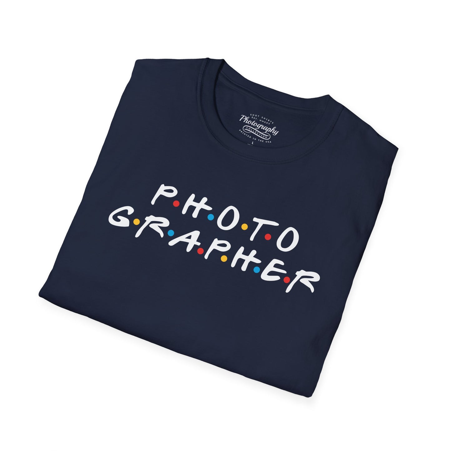 Folded navy blue t-shirt with 'PHOTOGRAPHER' text on a white background