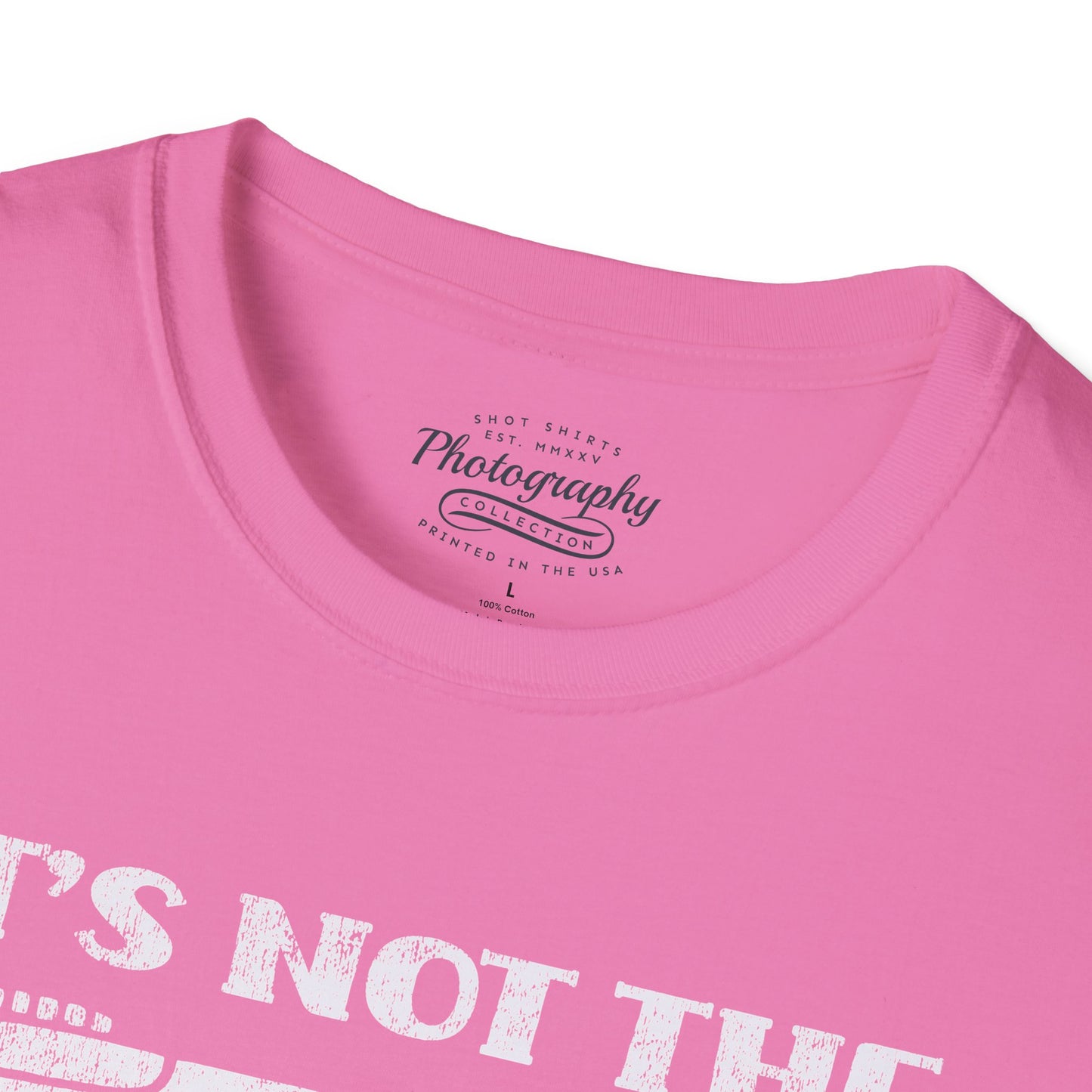 Close-up of a pink t-shirt with text and branding on a white background