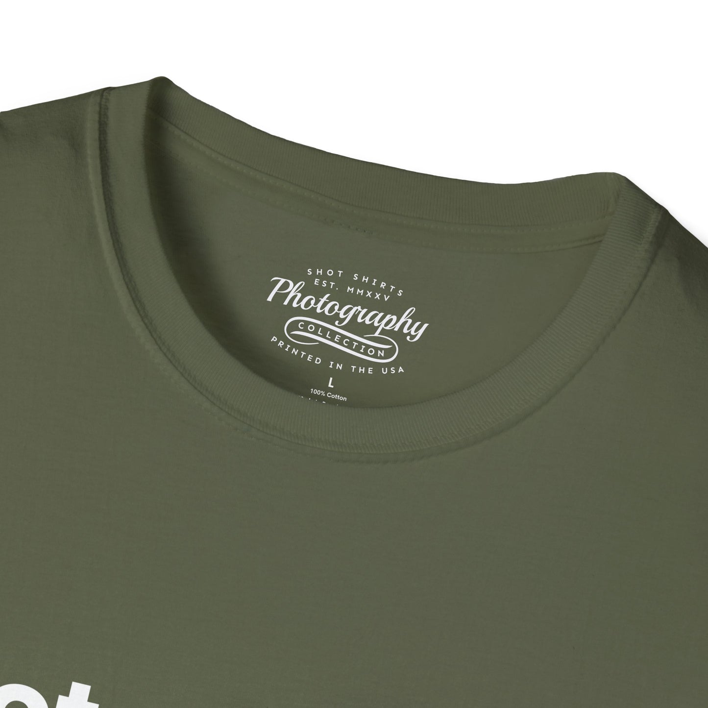 Close-up of a green t-shirt with a logo on the collar
