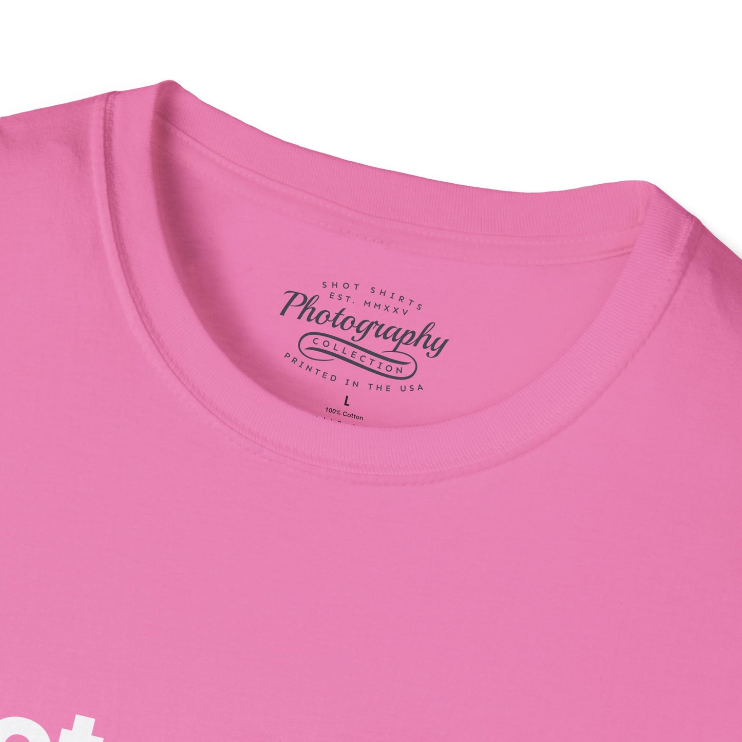 Close-up of a pink t-shirt with a label on the collar.