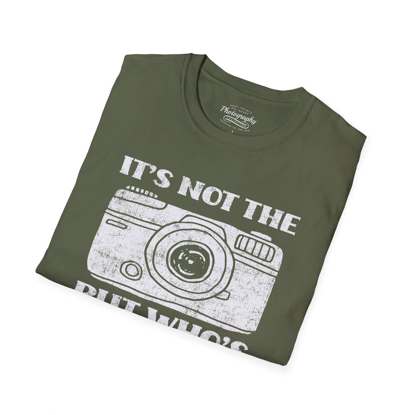 Folded green t-shirt with camera graphic and text on a white background