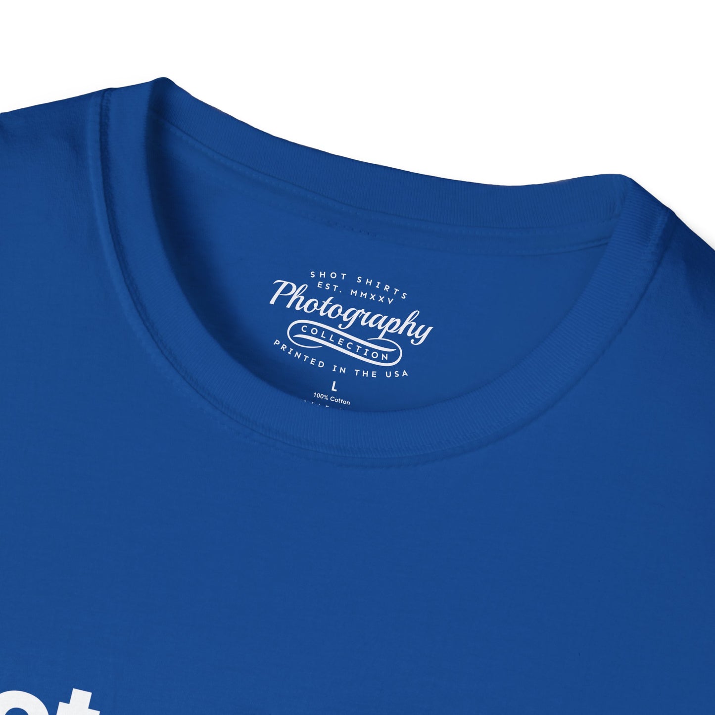 Close-up of a blue t-shirt with a white logo on the collar.