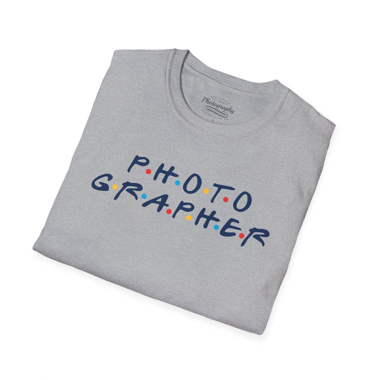 Folded gray t-shirt with 'PHOTOGRAPHER' text on a white background