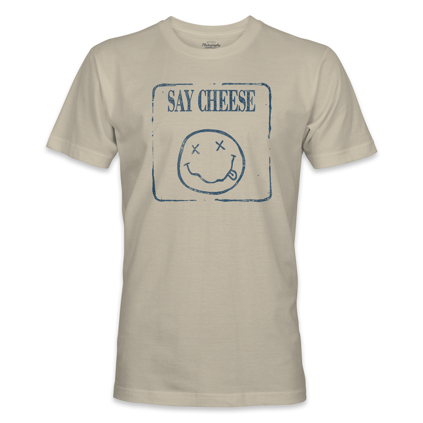 Sand t-shirt with a smiley face and 'Say Cheese' text on a white background