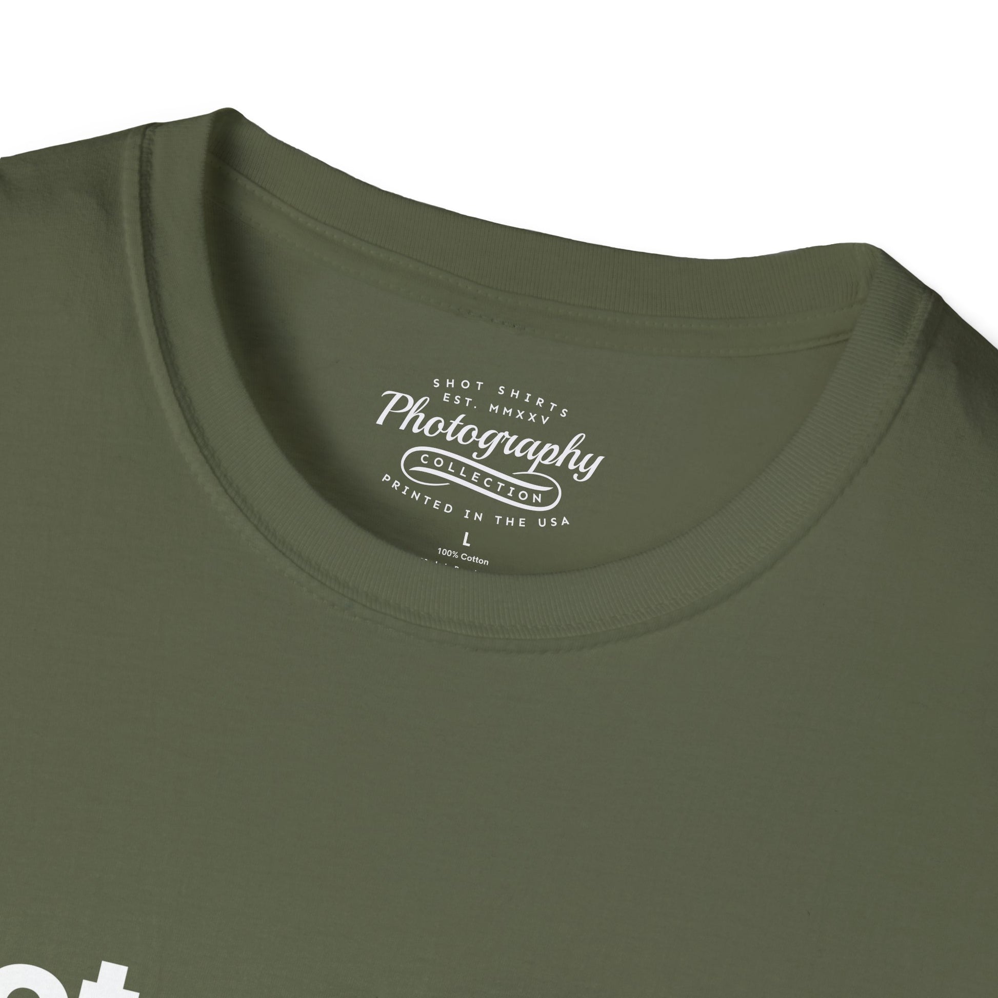 Close-up of a green t-shirt with a logo on the collar
