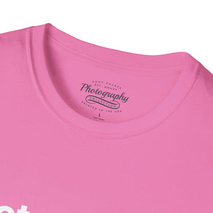 Close-up of a pink t-shirt with a label on the collar.