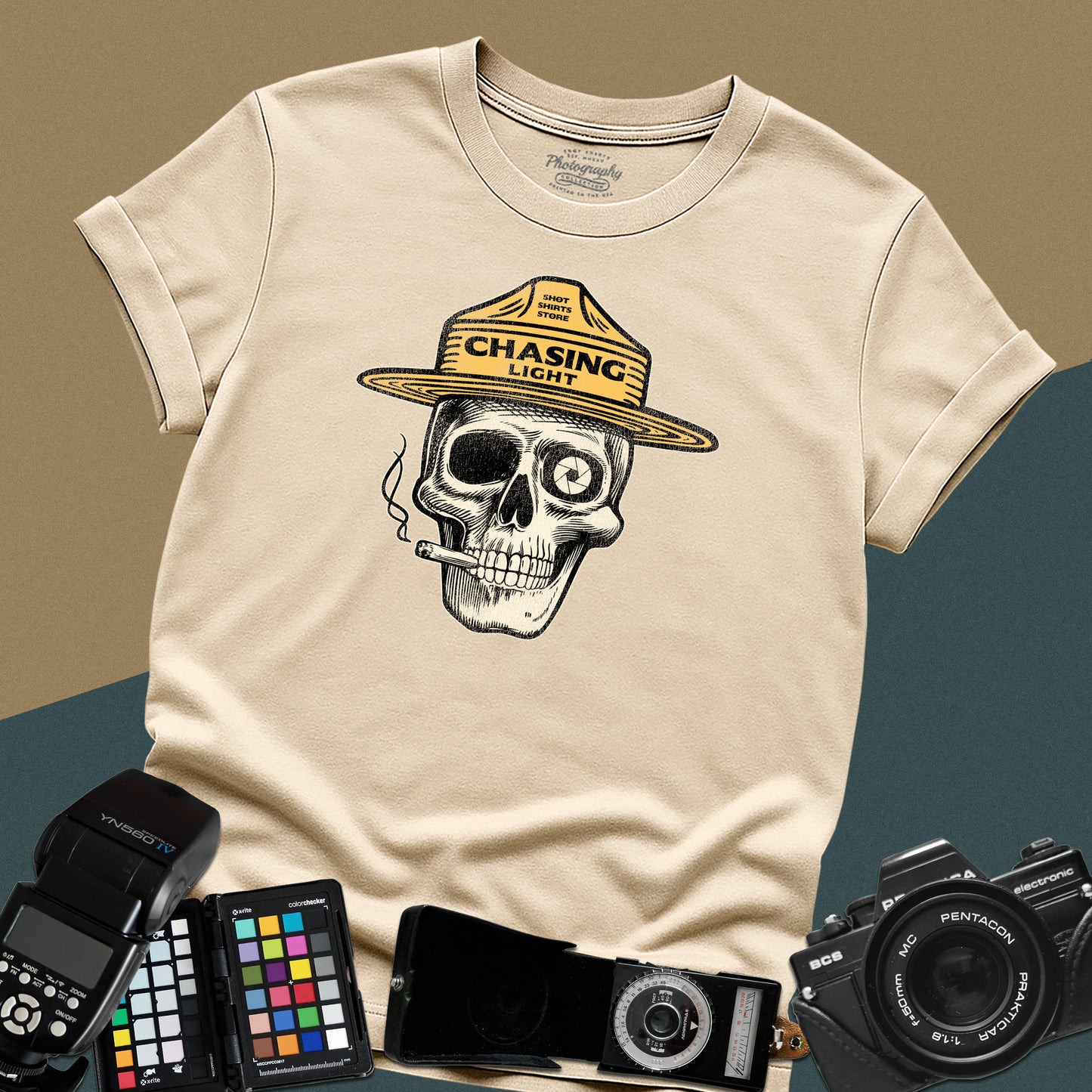 Vintage sand graphic t-shirt featuring a skull wearing a park ranger hat with the text "Chasing Light" for landscape photographers.