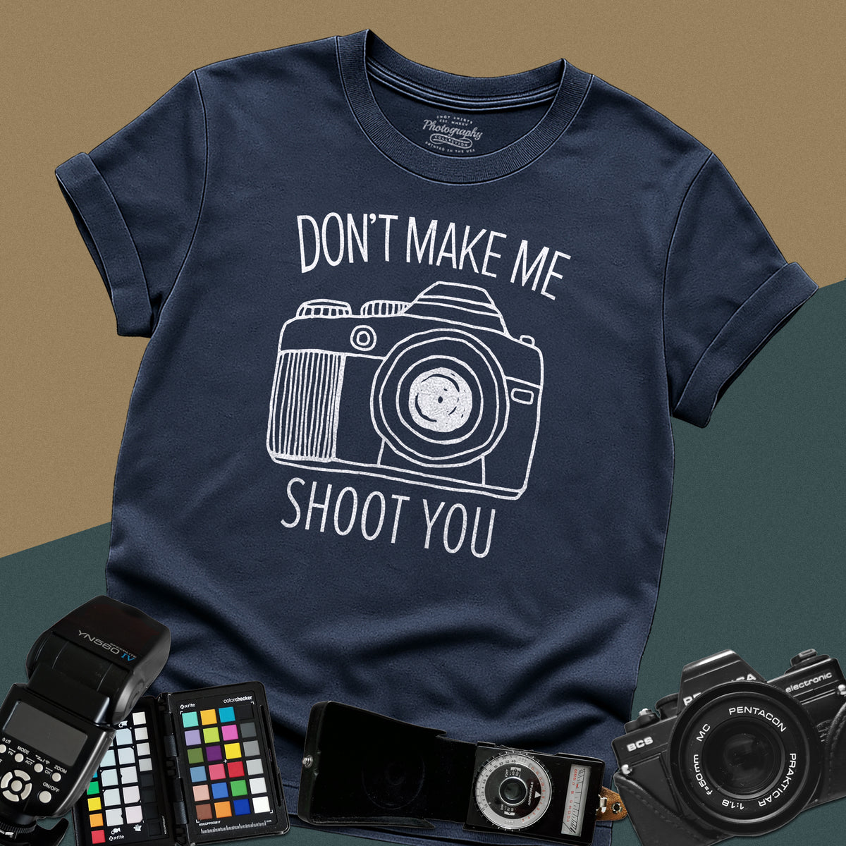 Heavy distressed navy-blue t-shirt featuring a detailed retro DSLR camera graphic with a funny, sarcastic typography quote for professional visual creators.