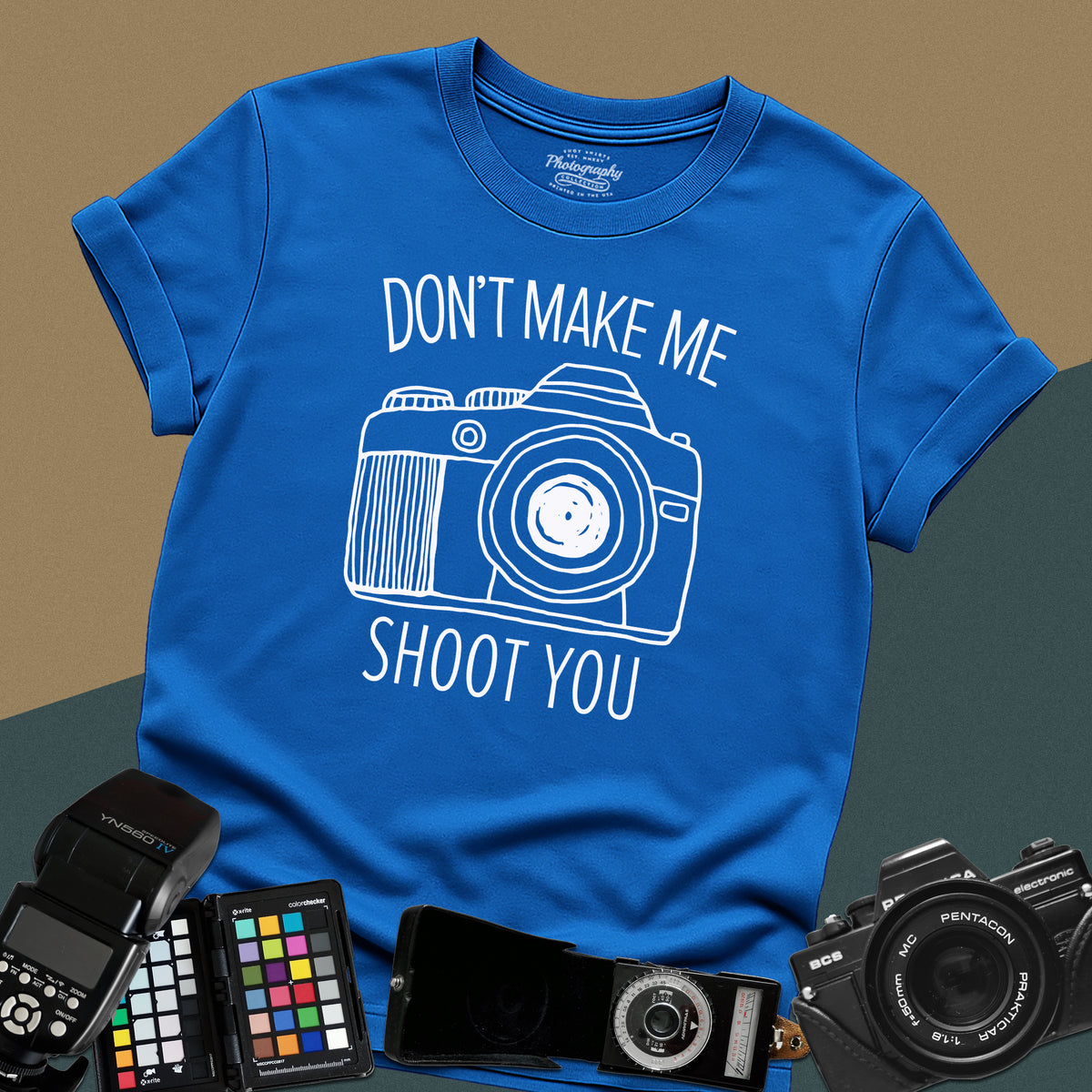 Heavy distressed royal-blue t-shirt featuring a detailed retro DSLR camera graphic with a funny, sarcastic typography quote for professional visual creators.