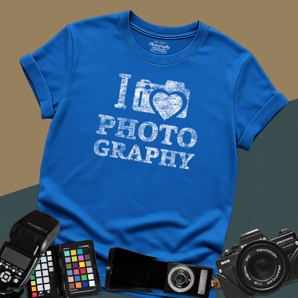 Heavy distressed royal-blue t-shirt featuring a retro camera icon with an integrated heart silhouette and bold split typography text "I Love Photography".