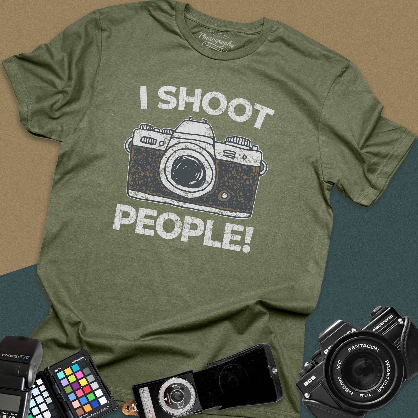Distressed military-green t-shirt featuring a vintage SLR camera graphic with bold text I Shoot People for professional portrait and street photographers.