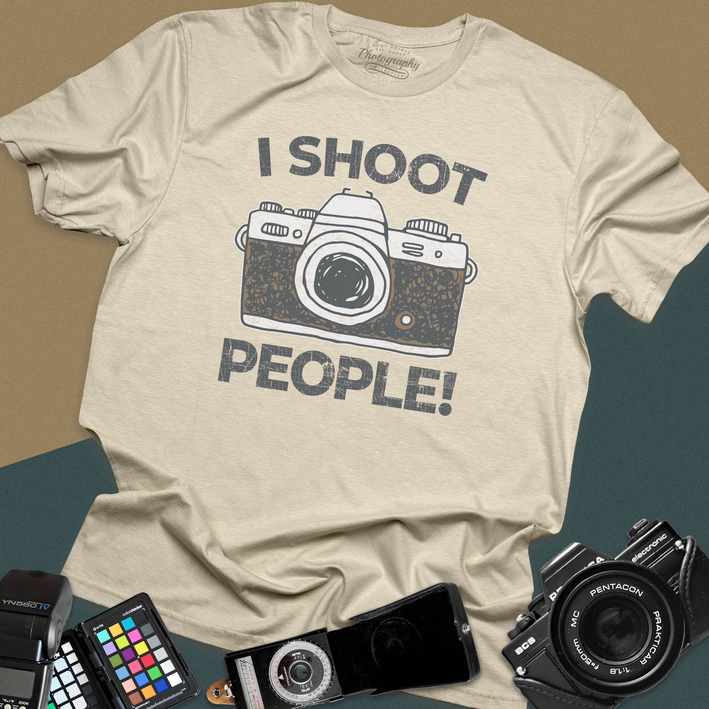 Distressed sand t-shirt featuring a vintage SLR camera graphic with bold text I Shoot People for professional portrait and street photographers.