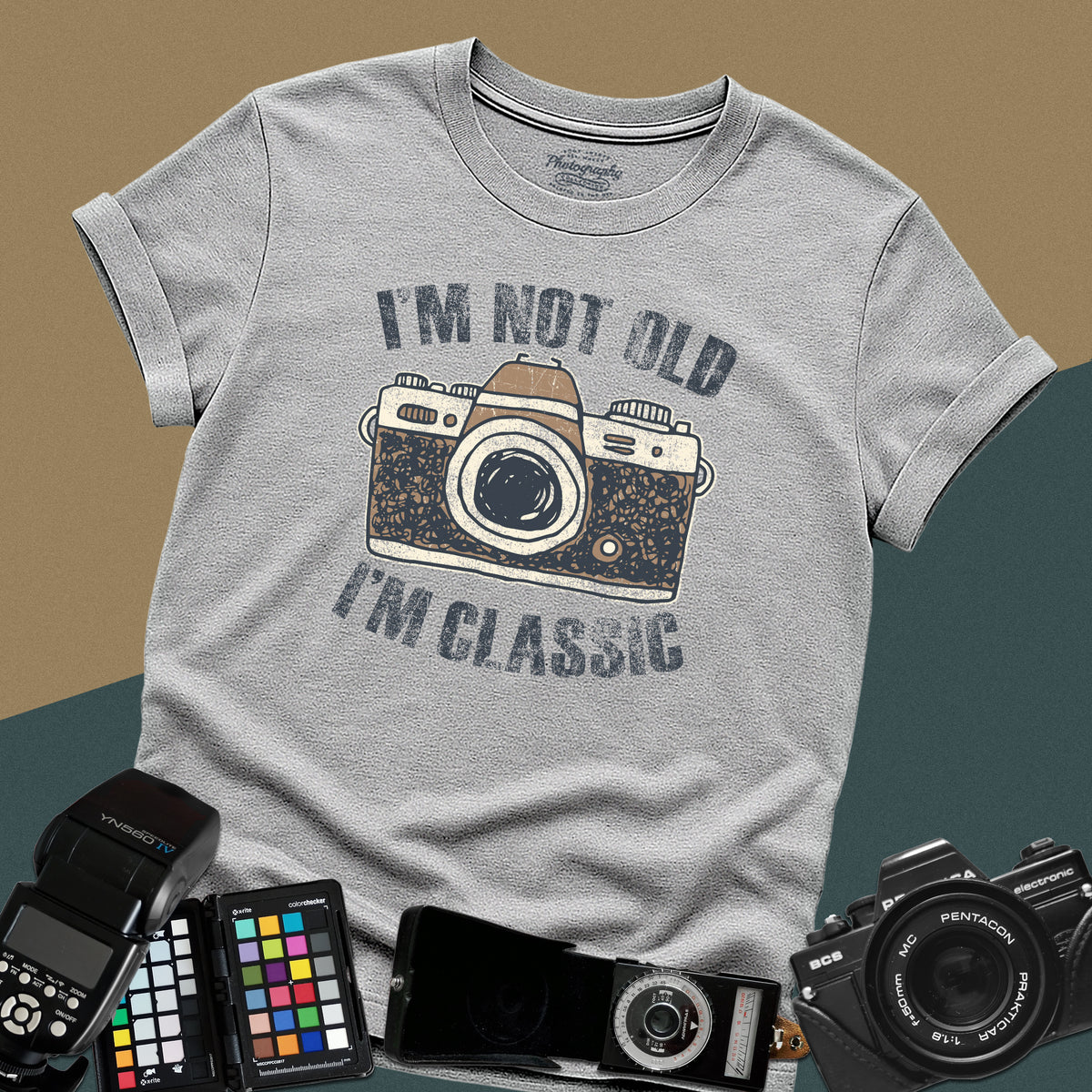Heavy distressed sport-grey t-shirt featuring a retro film camera graphic with arched text "I'm Not Old, I'm Classic" for professional analog photographers.