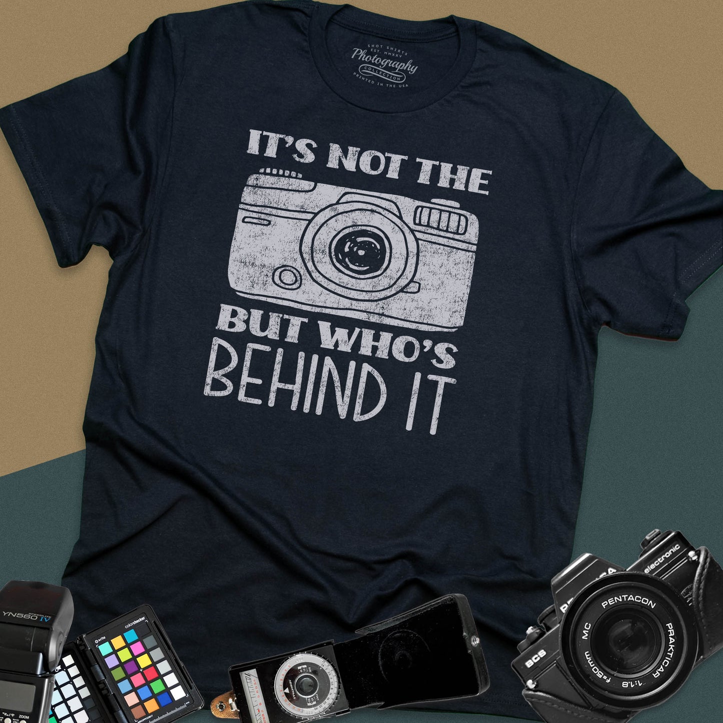 Distressed black t-shirt featuring a vintage rangefinder camera illustration with a bold retro typography quote for professional visual creators.