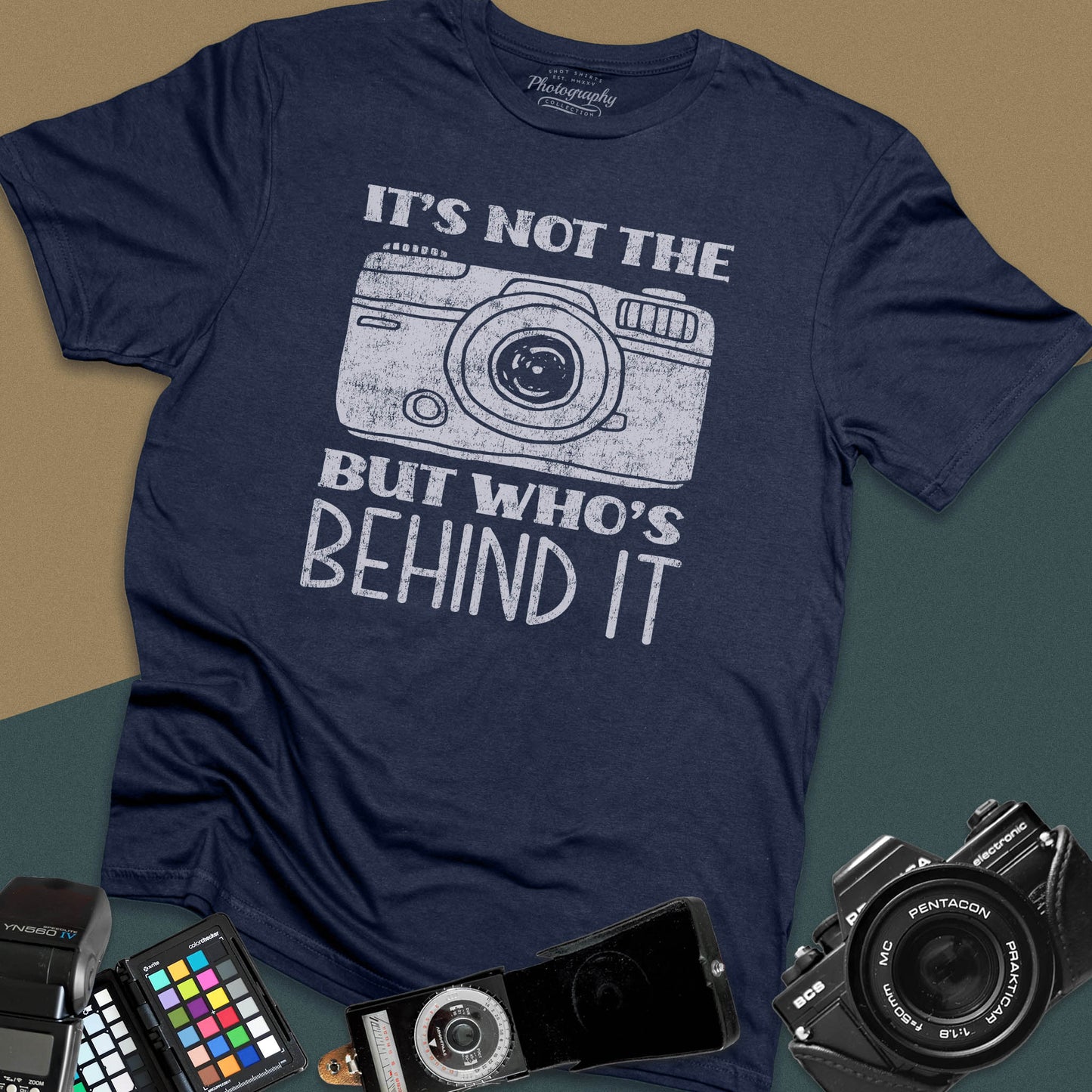 Distressed navy-blue t-shirt featuring a vintage rangefinder camera illustration with a bold retro typography quote for professional visual creators.