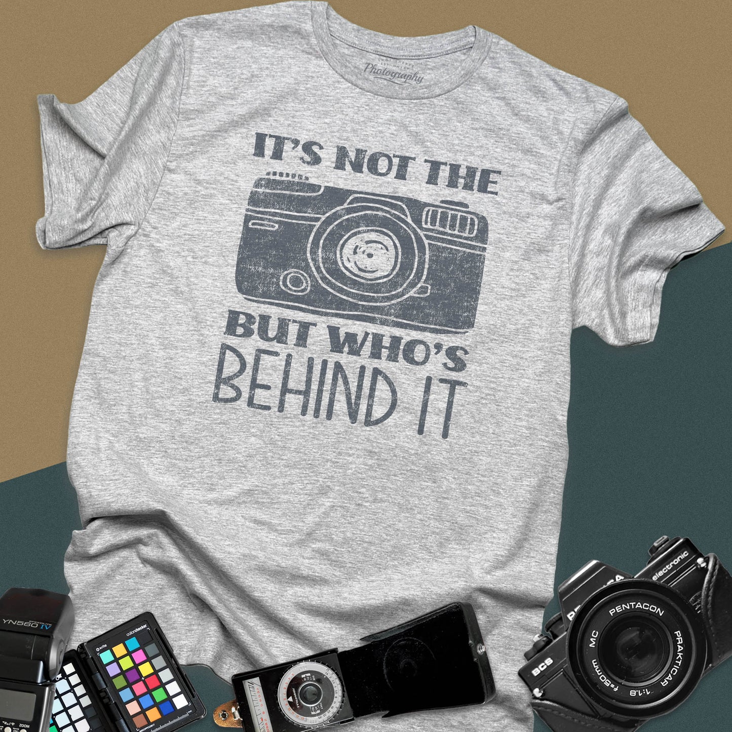 Distressed sport-grey t-shirt featuring a vintage rangefinder camera illustration with a bold retro typography quote for professional visual creators.