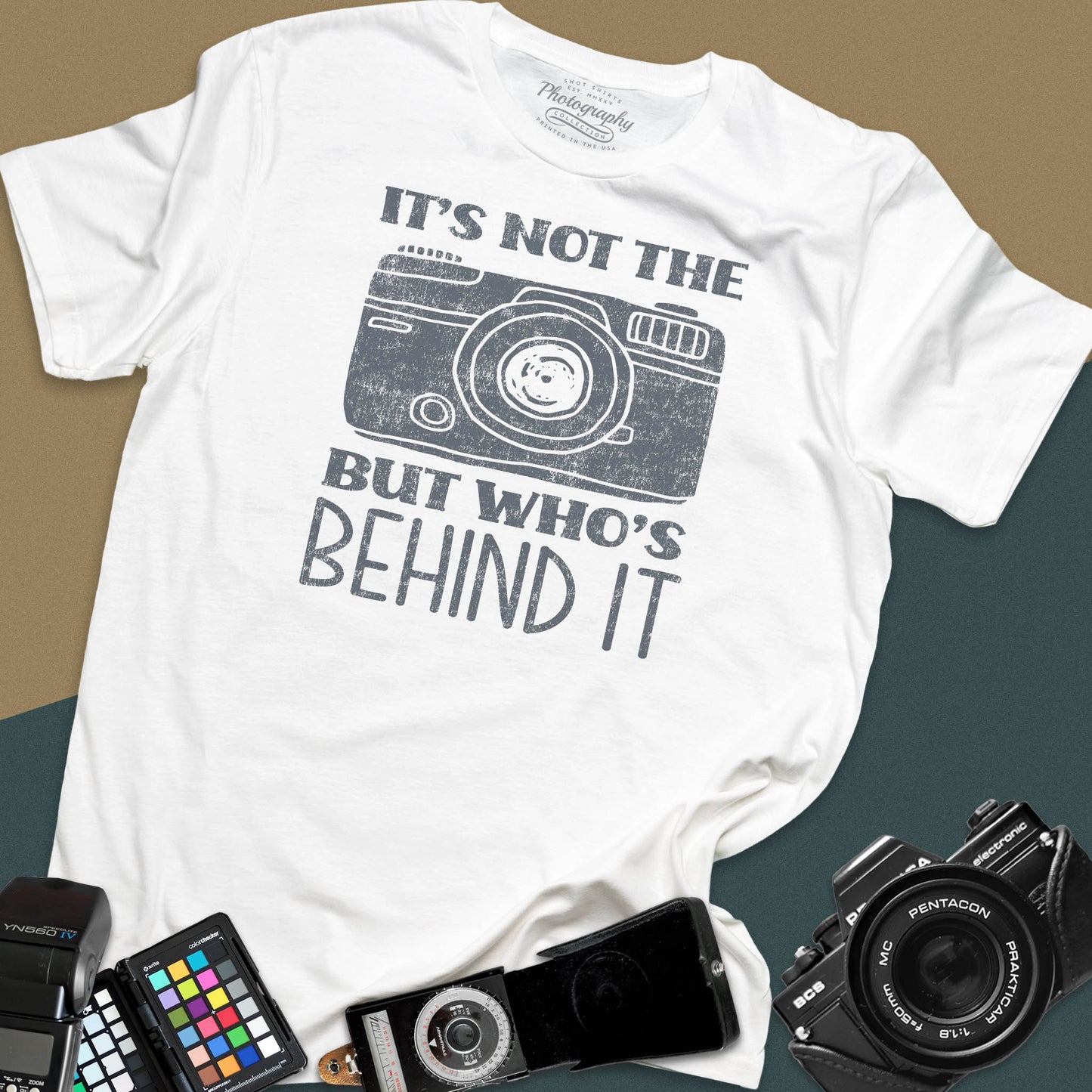 Distressed white t-shirt featuring a vintage rangefinder camera illustration with a bold retro typography quote for professional visual creators.