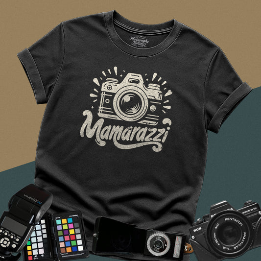 A black t-shirt featuring a distressed vintage camera graphic with sparkles and the stylized text "Mamarazzi" written in a retro script font across the chest.