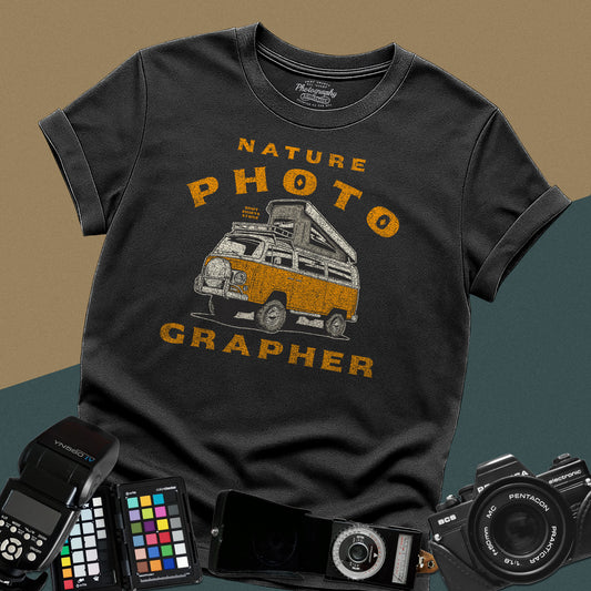 Vintage black t-shirt featuring a distressed orange camper van with nature photographer typography for outdoor landscape photography lovers.