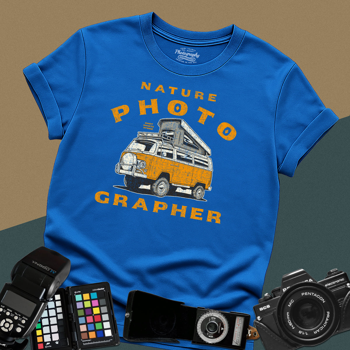 Vintage royal blue t-shirt featuring a distressed orange camper van with nature-photographer typography for outdoor landscape photography lovers.