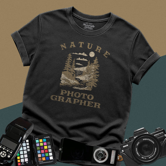 Vintage black graphic t-shirt featuring a mountain lake landscape with pine trees and the text "Nature Photographer" for landscape shooters.