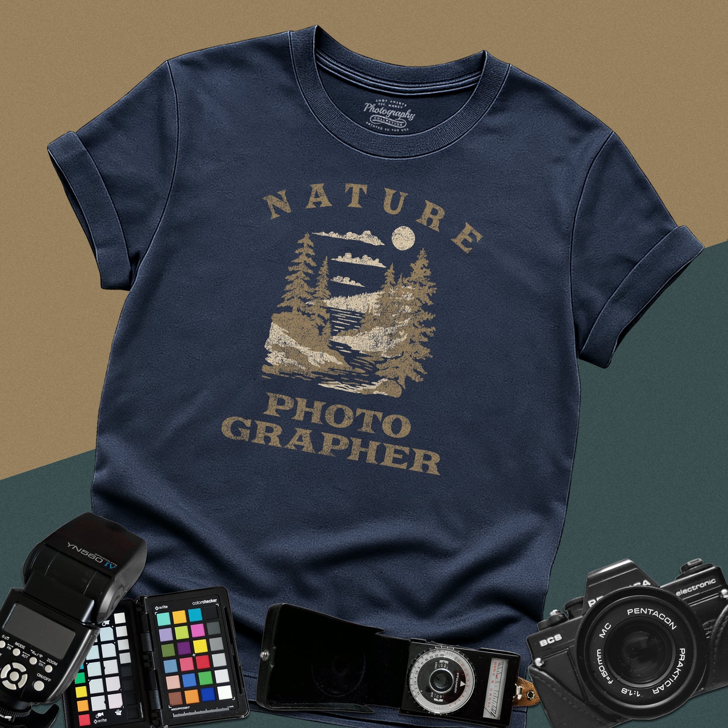 Vintage navy-blue graphic t-shirt featuring a mountain lake landscape with pine trees and the text "Nature Photographer" for landscape shooters.