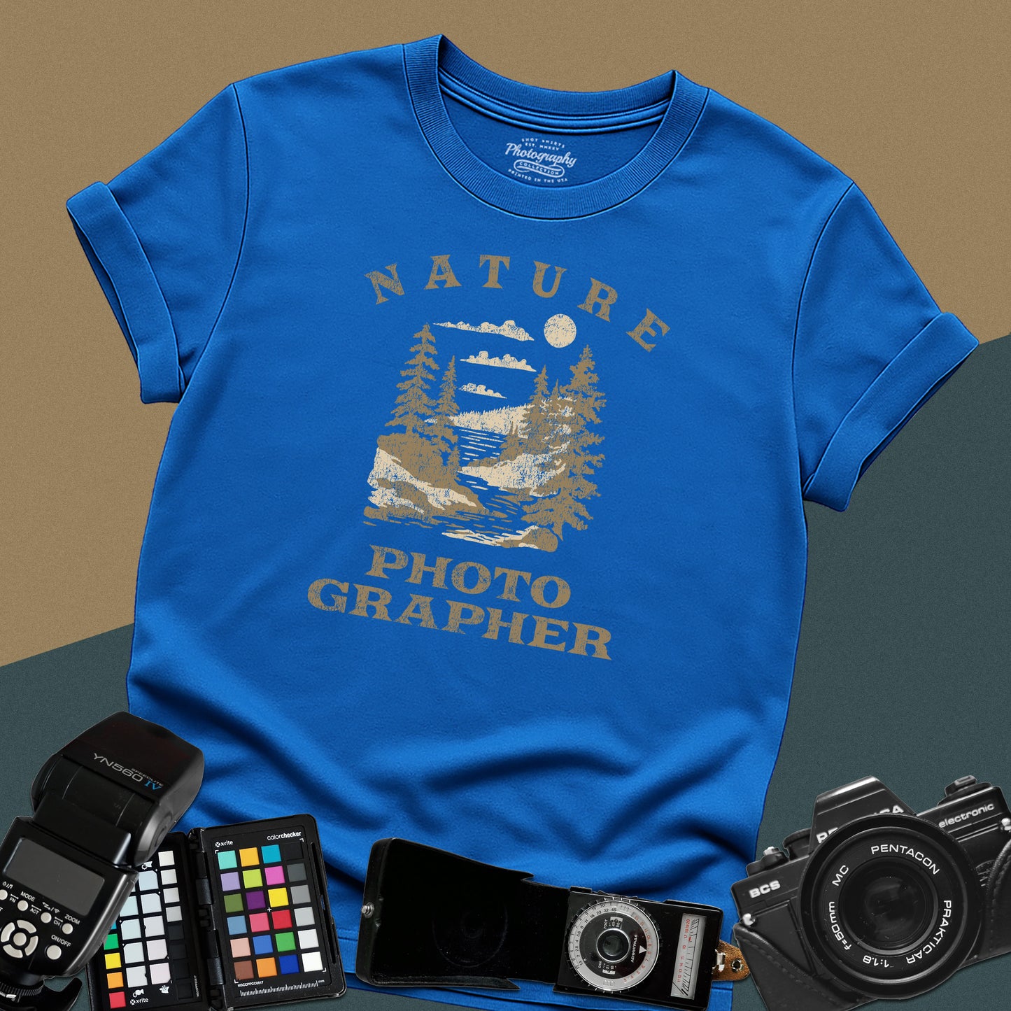 Vintage royal-blue graphic t-shirt featuring a mountain lake landscape with pine trees and the text "Nature Photographer" for landscape shooters.