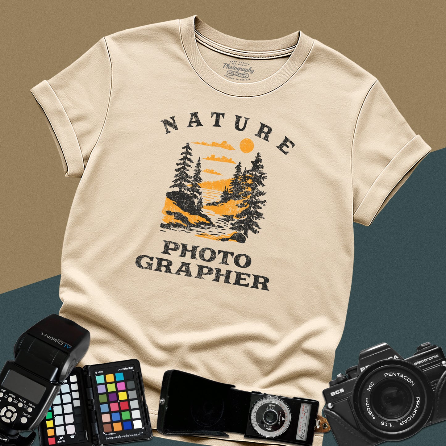 Vintage sand graphic t-shirt featuring a mountain lake landscape with pine trees and the text "Nature Photographer" for landscape shooters.