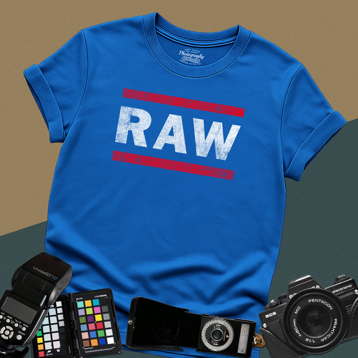 Distressed royal-blue t-shirt featuring a textured RAW photography file format typography design inspired by a classic retro sports entertainment wrestling show logo.