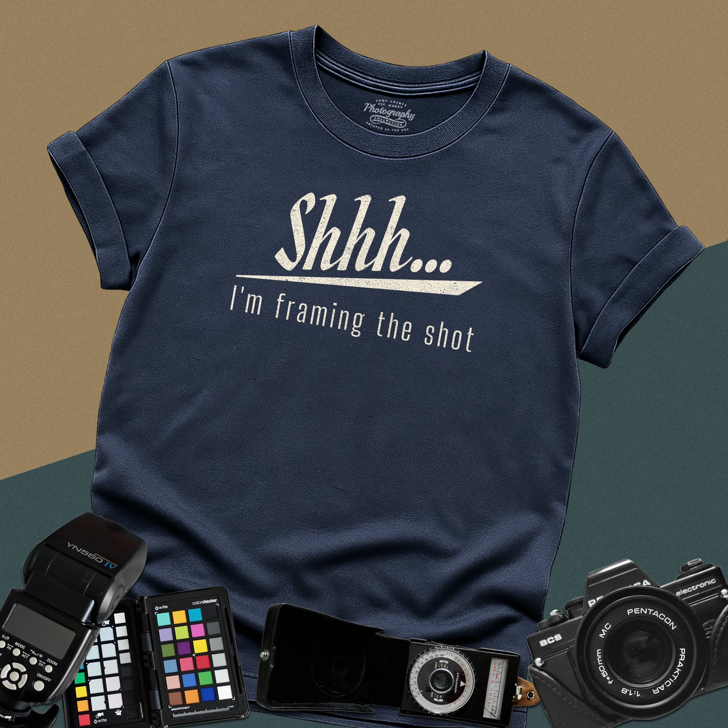 Minimalist navy-blue t-shirt featuring the distressed vintage text "Shhh... I'm framing the shot" for professional portrait photographers.