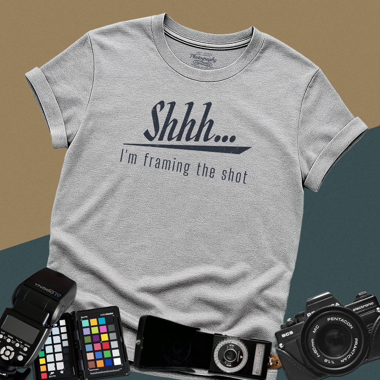 Minimalist sport-grey t-shirt featuring the distressed vintage text "Shhh... I'm framing the shot" for professional portrait photographers.