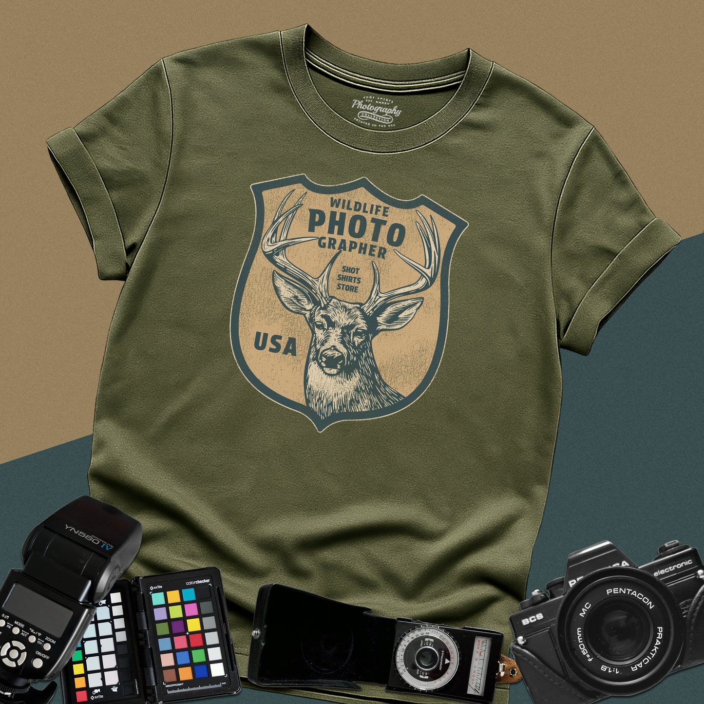 Vintage military-green graphic t-shirt featuring a retro emblem with a deer and the text "Wildlife Photographer USA" for nature shooters.