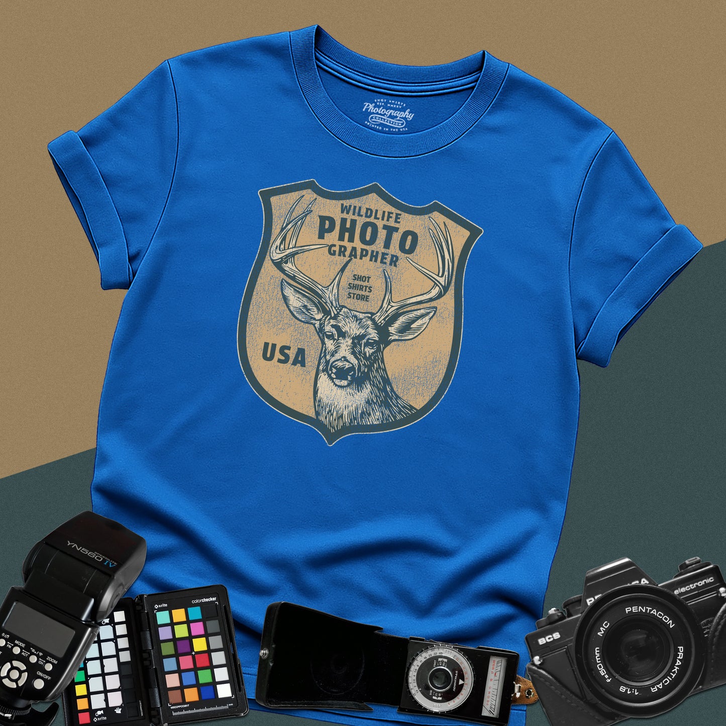 Vintage royal-blue graphic t-shirt featuring a retro emblem with a deer and the text "Wildlife Photographer USA" for nature shooters.