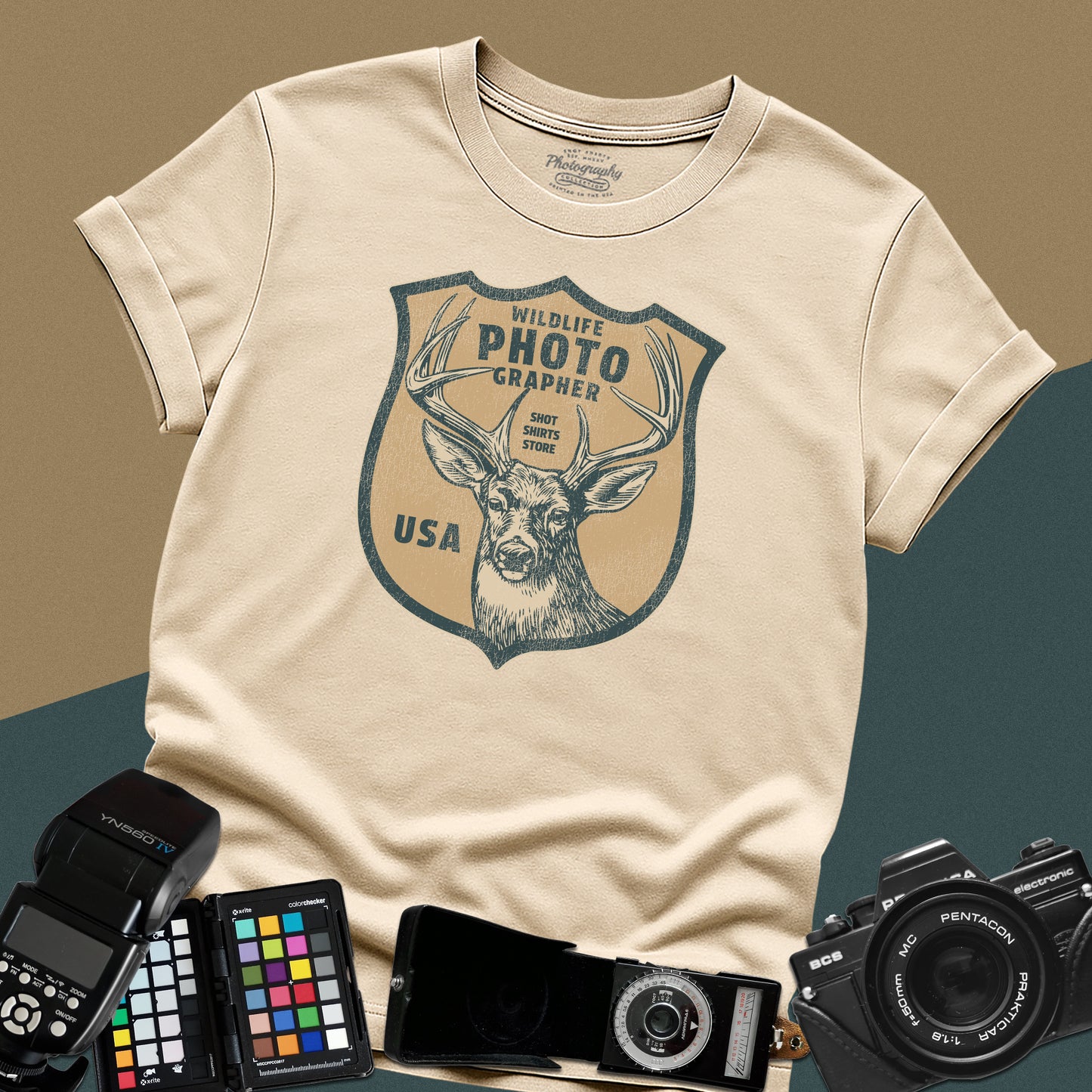 Vintage sand graphic t-shirt featuring a retro emblem with a deer and the text "Wildlife Photographer USA" for nature shooters.