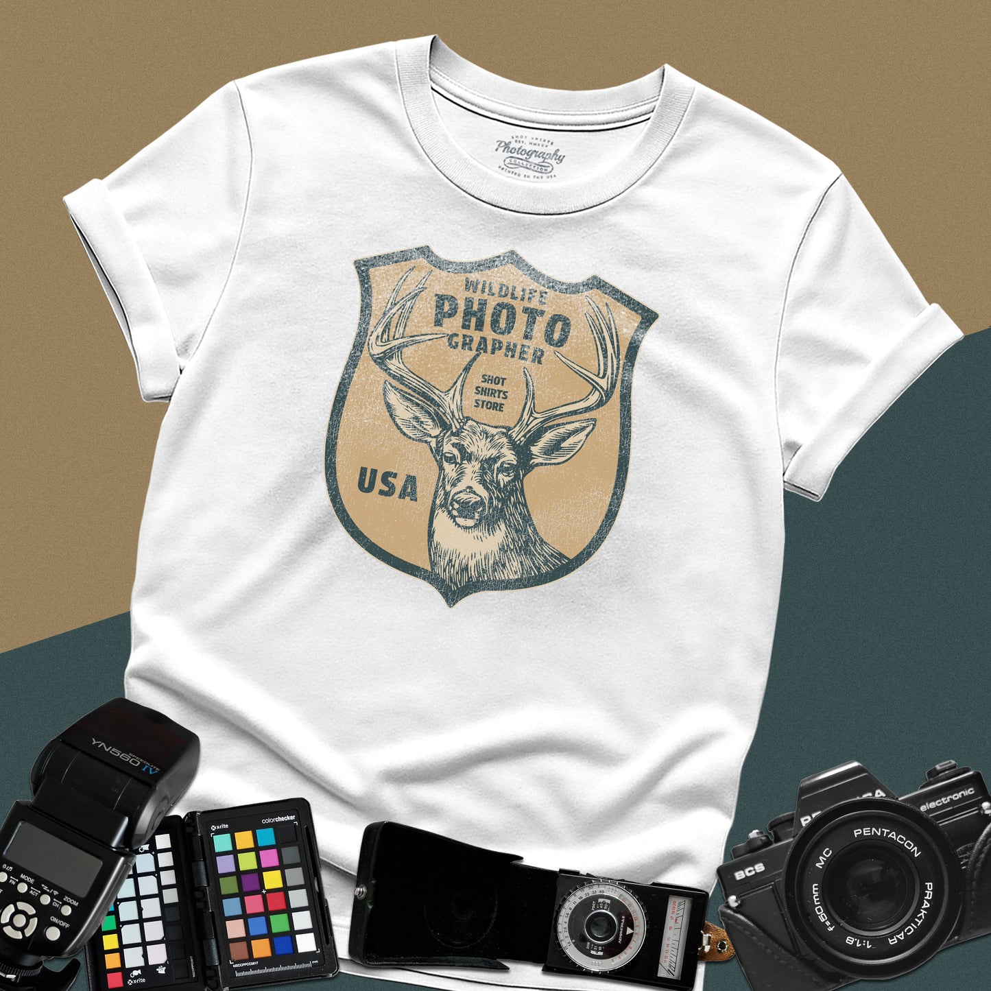 Vintage white graphic t-shirt featuring a retro emblem with a deer and the text "Wildlife Photographer USA" for nature shooters.